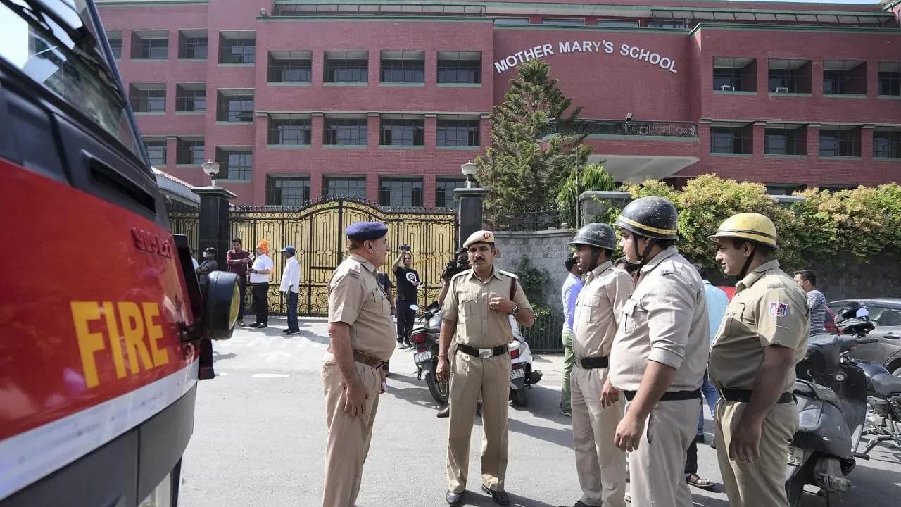 Cops taking charge at the school after getting the threat email.  (Credit: PTI)