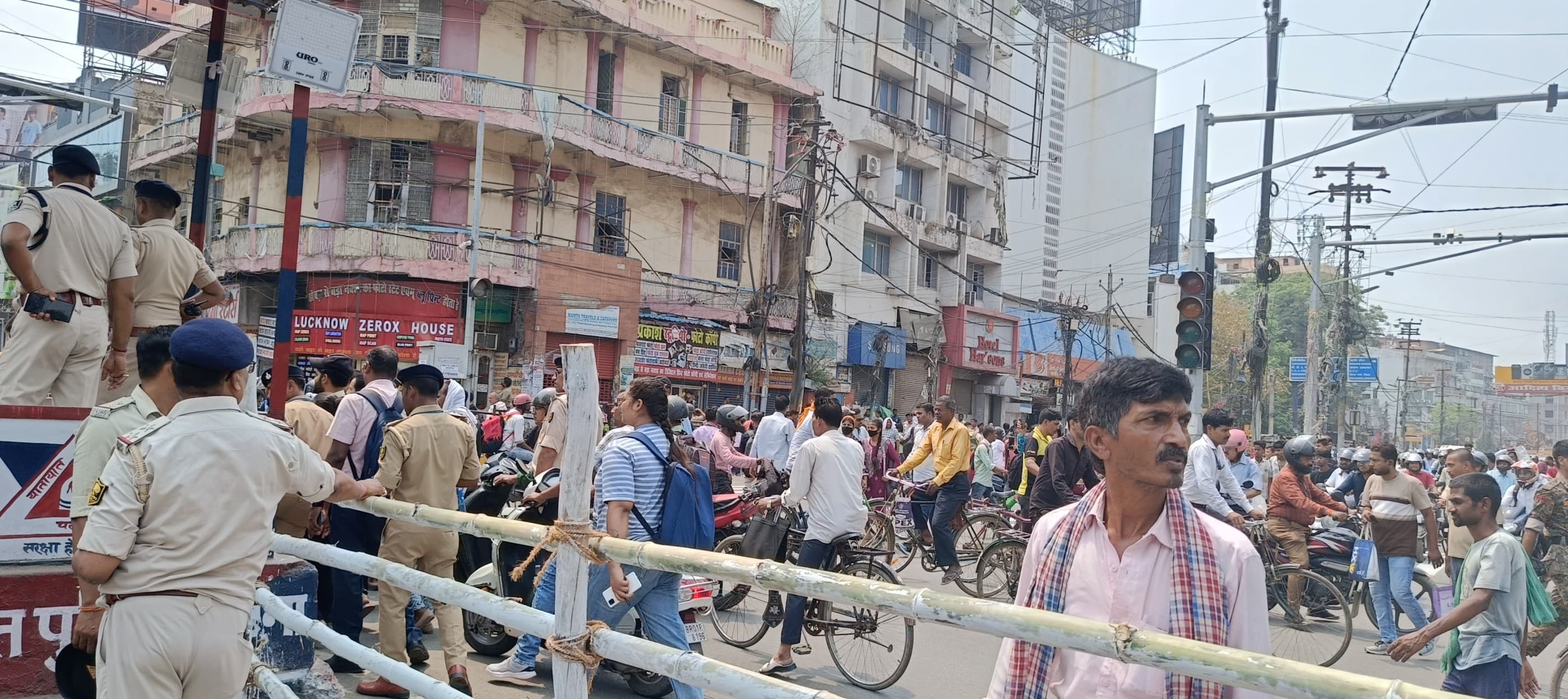 Patna residents wait for a road blockage at the Dak Bungalow Chouraha to be lifted so they can go about their daily lives. (Image Credit: Prabhav Anand)