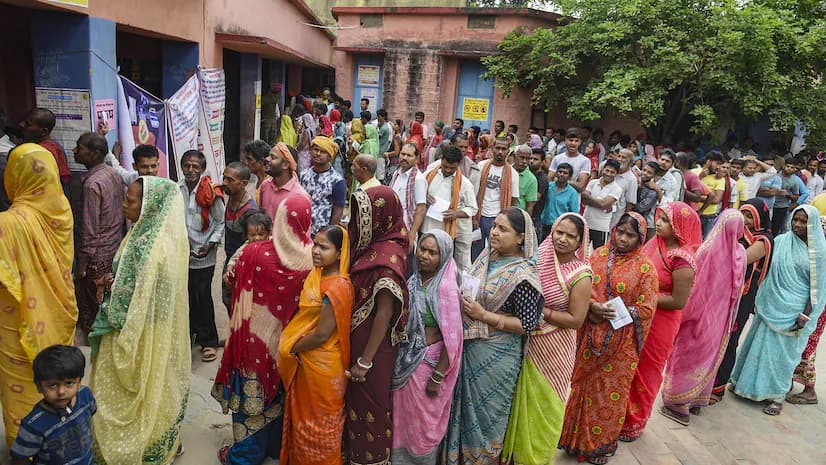 Voters Waiting In Queues Outside A Polling Station During The Lok Sabha Polls