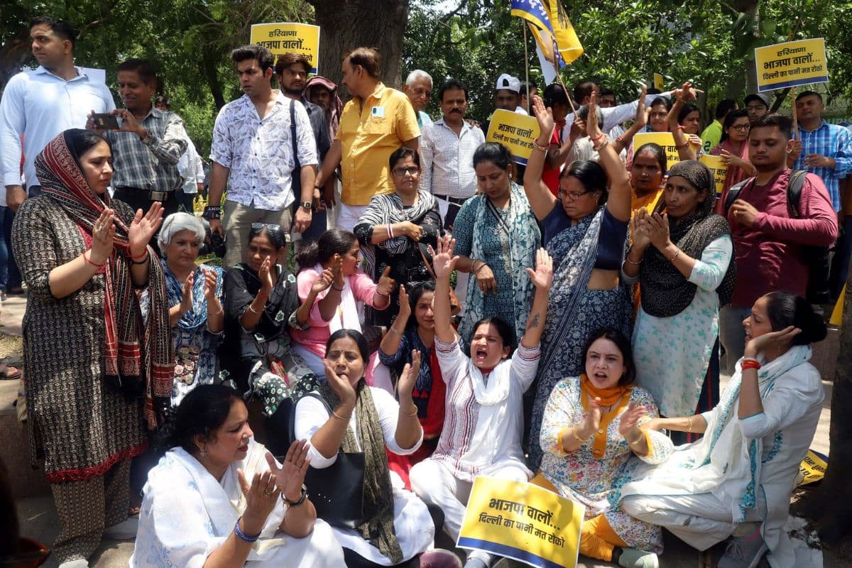 Police detained Protester while AAP workers was protesting over the water crisis at Mandi House, in the capital on Monday