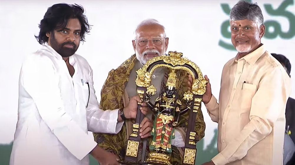 Chandrababu Naidu Swearing-in Ceremony: Andhra CM Naidu and newly inducted minister Pawan Kalyan felicitating Prime Minister Narendra Modi.