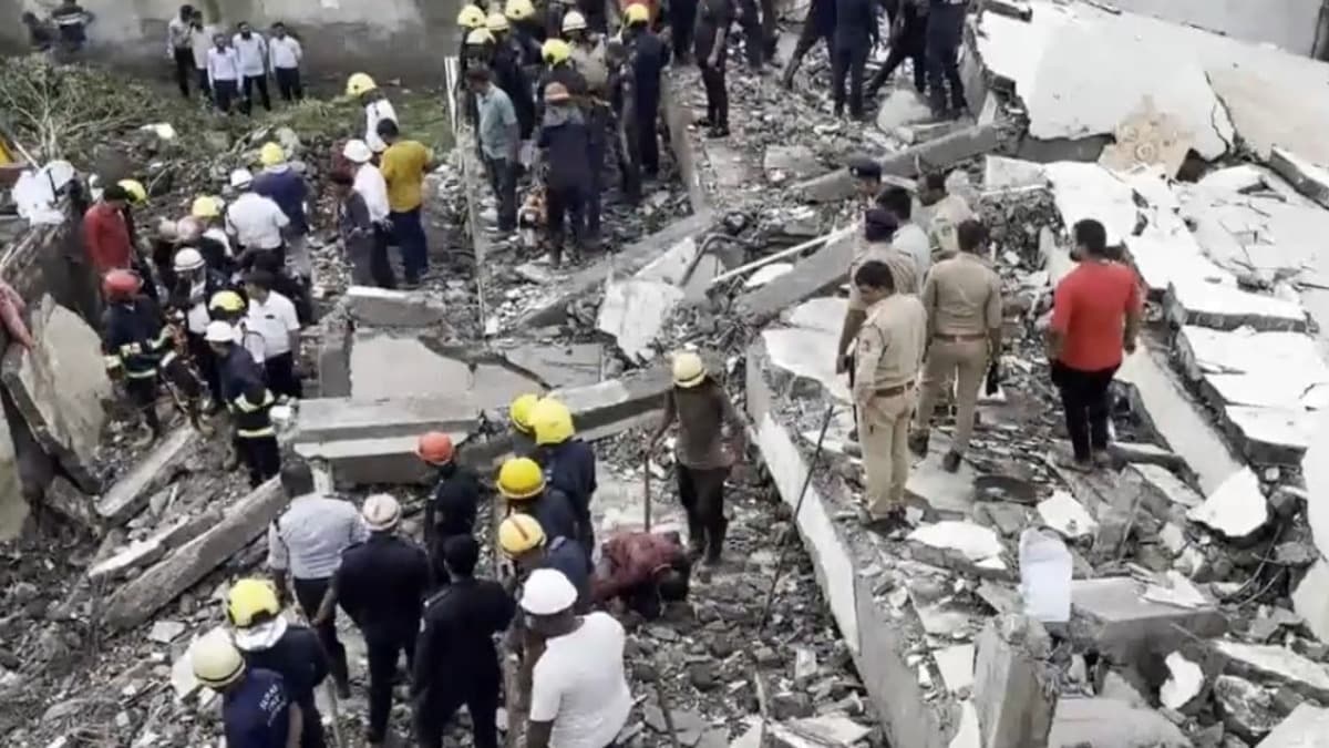 Emergency responders, including police and fire department officials, are actively engaged in a rescue operation at the scene. Photo Credit: X/ANI Videos