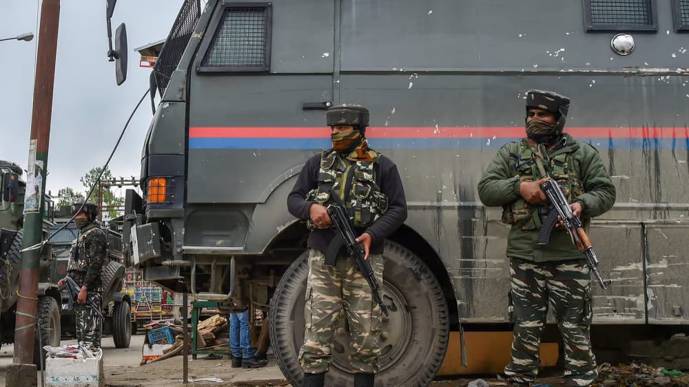 File photo of security personnel standing guard during an encounter with the militants in Jammu and Kashmir.