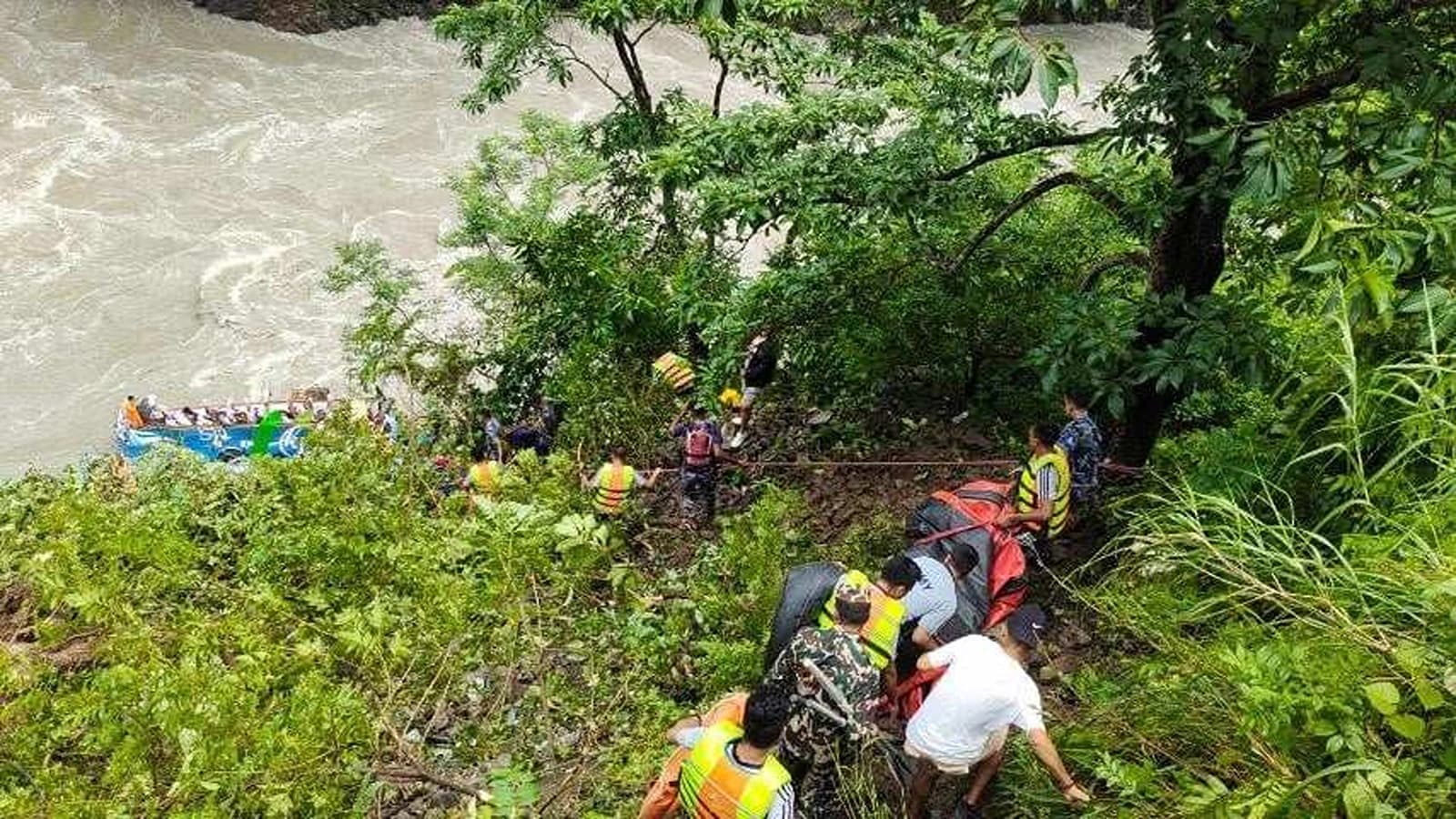 Security personnel and the locals have started rescue efforts after the bus plunged into the river.