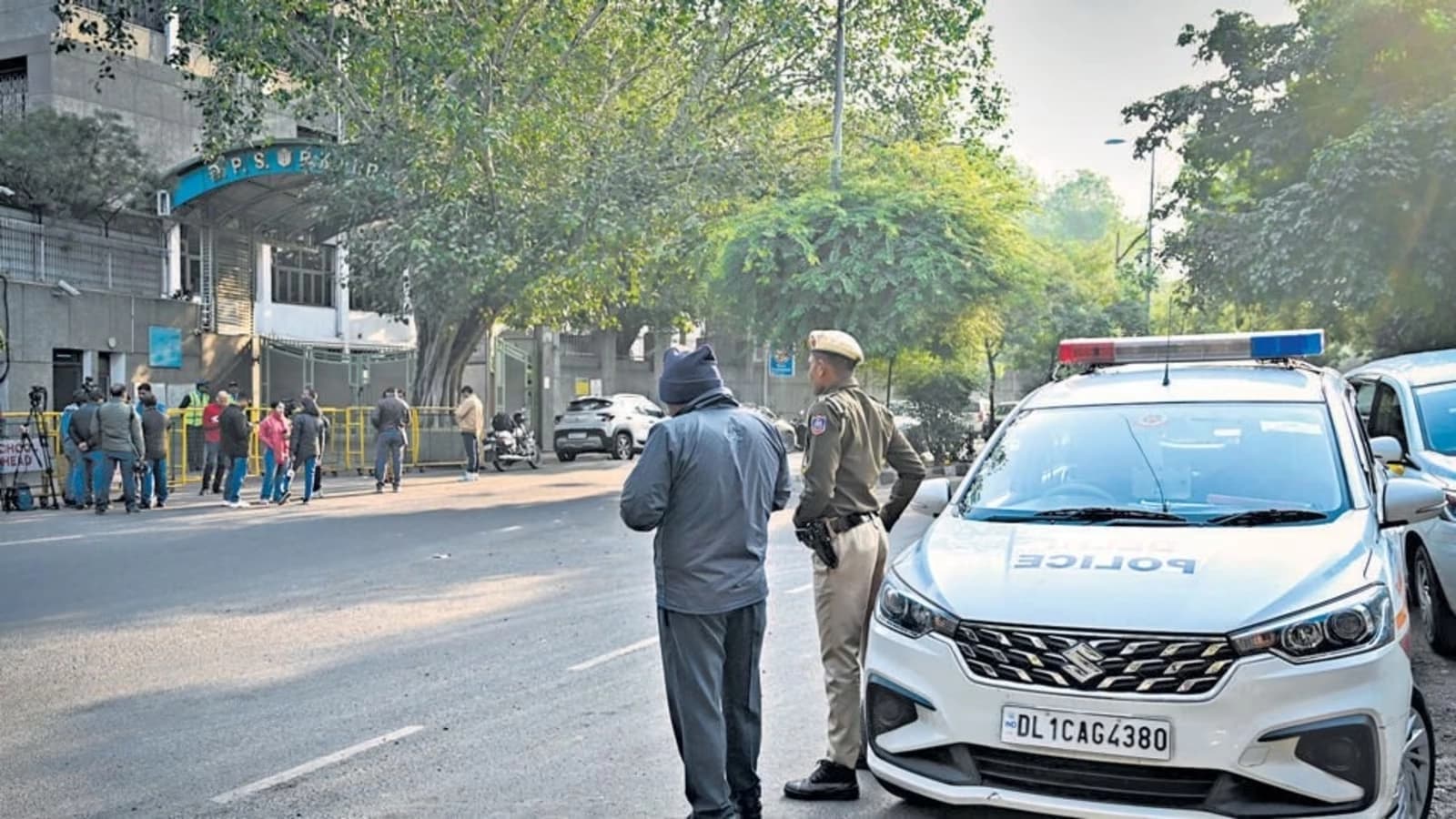 Security personnel outside school protecting