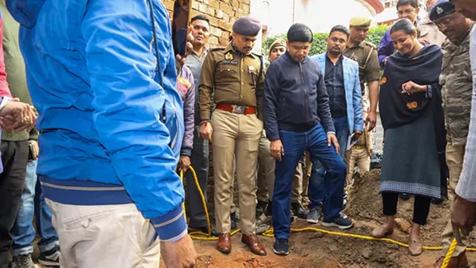 Police officers and others gathered near a well at a newly opened temple in Sambhal, Uttar Pradesh, on December 15. (Image Source: PTI)