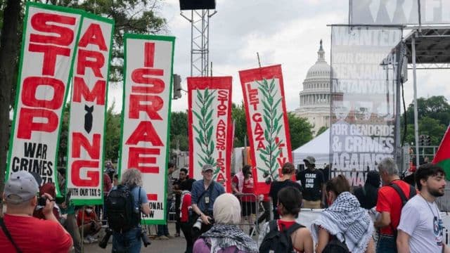 Pro-Palestinian protesters take down and burn US flag near Congress during Israeli PM's visit