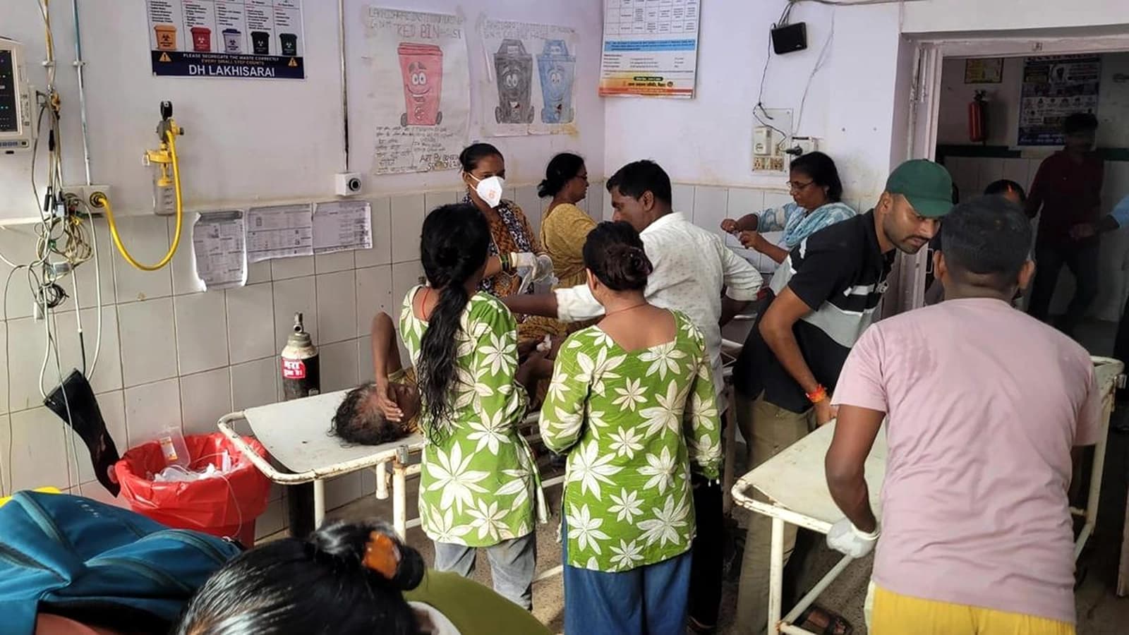 Devotees and security personnel at Ashok Dham temple in Lakhisarai after a stampede killed seven people on August 17, 2026