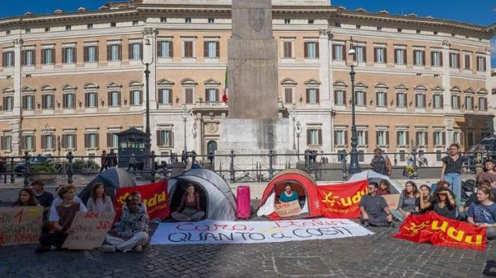 ‘Dear Italy, how much do you cost us?’ Students pitch tents over soaring rents
